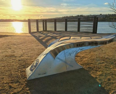 Giant leaf bench on the bank of the Plym Estuary | Plymouth | Thrussells sunsets over the Plym Estuary with a giant leaf bench by the waters side. Plymouth public art