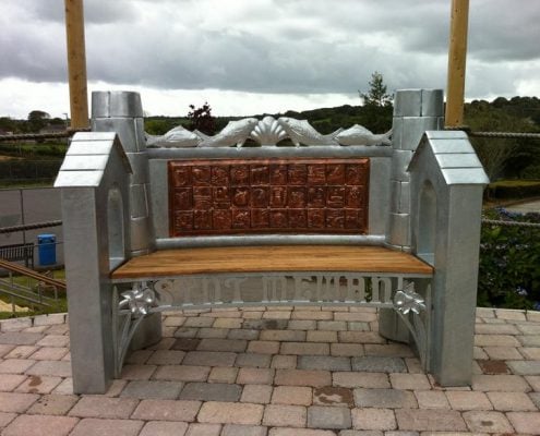 St Mewan School Heritage Bench | St Mewan, Cornwall | Thrussells Cornish heritage, fishing and mining themed bench made of metal and oak. Made by Thrussells. Public Art Cornwall