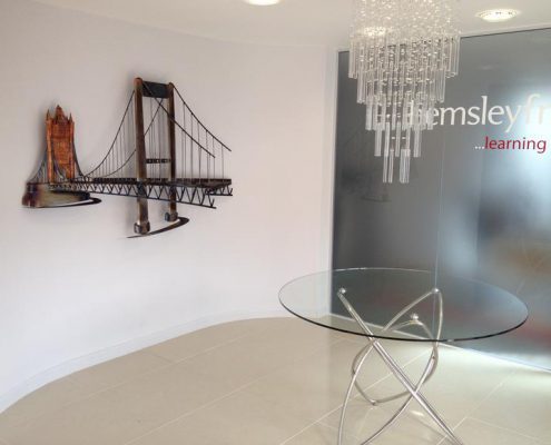 Hemsley Fraser offices wall sculpture of Saltash Tamar Bridge and London Tower Bridge | Saltash, Cornwall | Thrussells copper and steel wall sculpture of Tamar bridge and London Tower bridge. Made by Thrussells