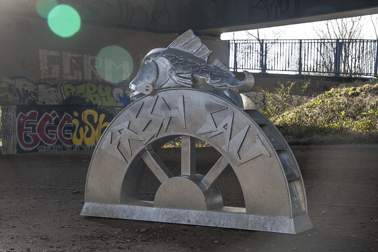 'Fresh Salt' feature sculpture on the Plym Valley Heritage Trail | Plymouth | Thrussells Metal sculpture of a steampunk styled fish sat on a water wheel. Plymouth public art