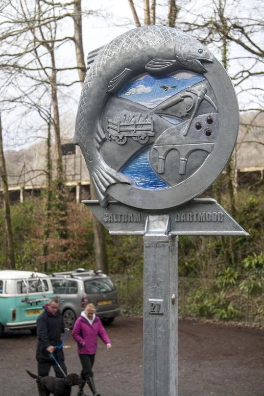 Waymarker Plym Valley Heritage Trail blue sky glass. Plym Bridge | Plymouth | Thrussells Waymarker sign made of metal and blue glass. Fish and railway themed. Plymouth public art