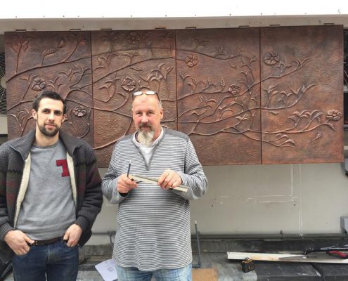 Copper Repoussé wall sculpture panels | Mayfair, London | Thrussells Thomas and Gary with their copper Repoussé tree wall sculpture panels. Made by Thrussells. Mayfair, London
