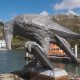 metal bird sculpture holding a book. Public Art Cornwall