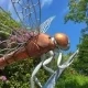 head, torso legs of a dragonfly sculpture made of copper and steel.