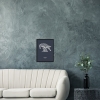 Black wooden A3 frame print with Thrussells cream bird on navy blue by sofa