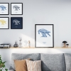 Black wooden A3 frame print with Thrussells blue bird in living room